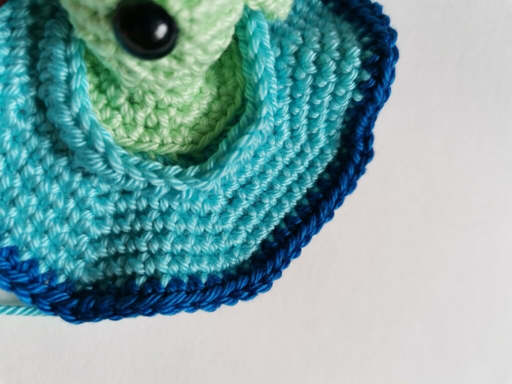 Assembling the crochet UFO parts.