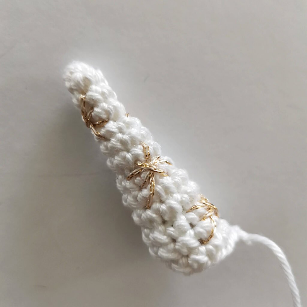 crochet white unicorn horn with golden stars