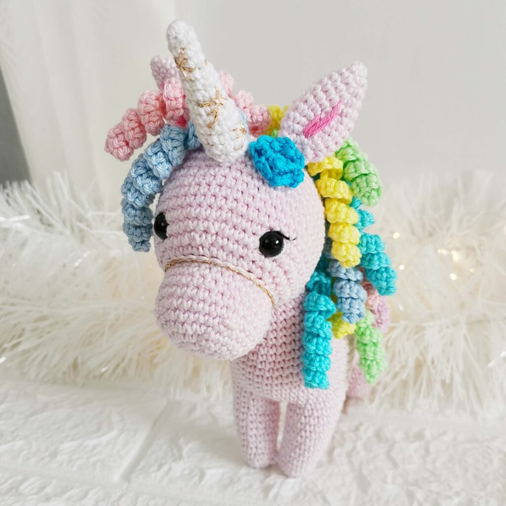 Finished amigurumi made using the free unicorn crochet pattern.