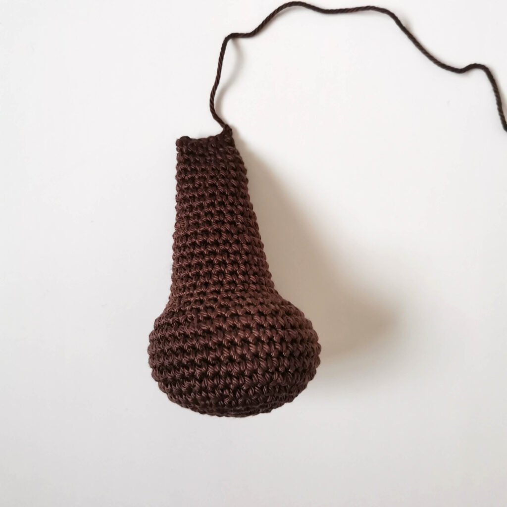 Completed dark brown amigurumi bear leg with clean stitches by EmmaS Dolls