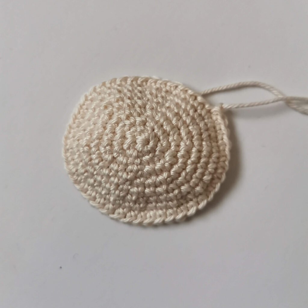 Crocheted muzzle with beige yarn for a classic amigurumi teddy bear free pattern by EmmaS Dolls.