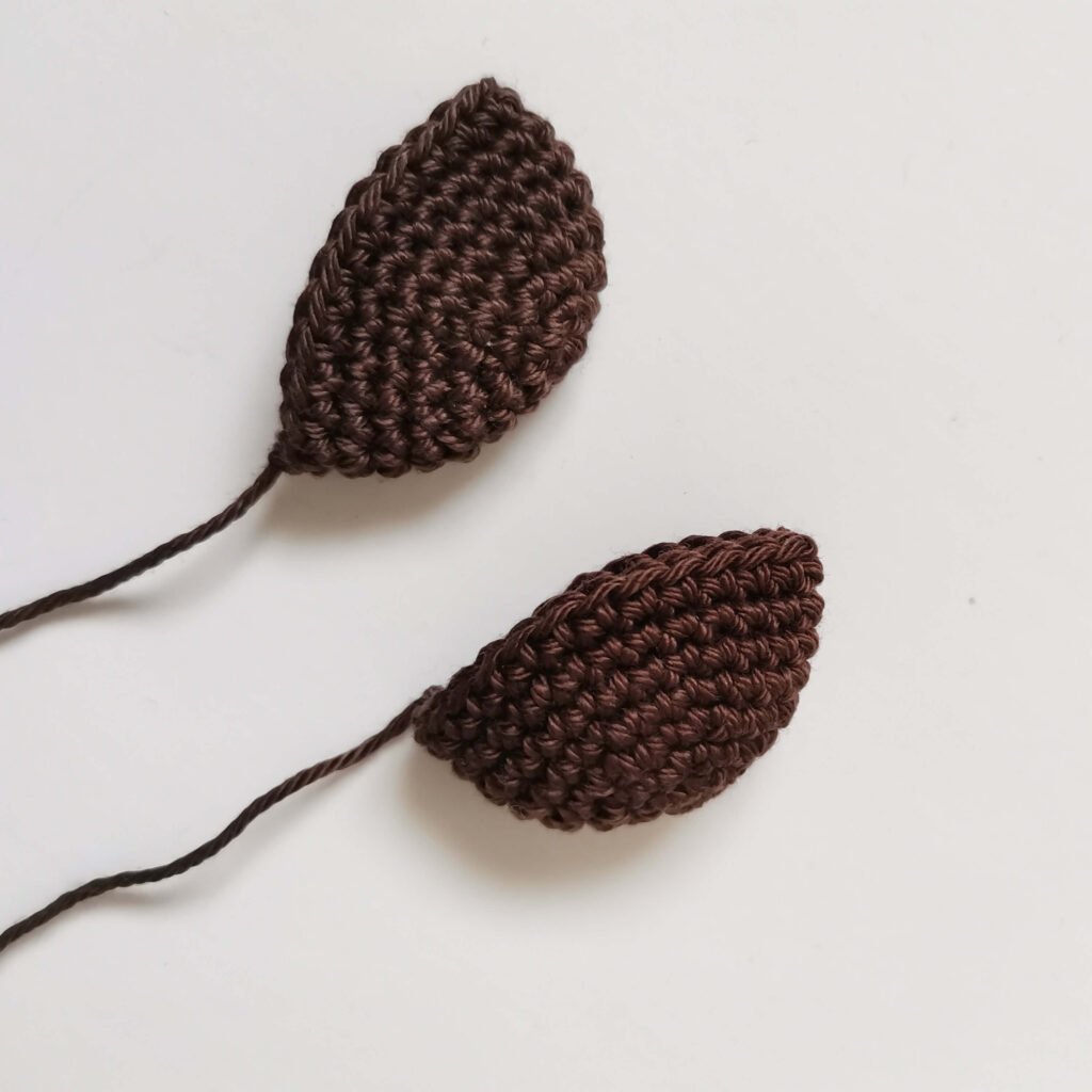 Crochet ears with brown yarn for a classic amigurumi teddy bear free pattern by EmmaS Dolls.