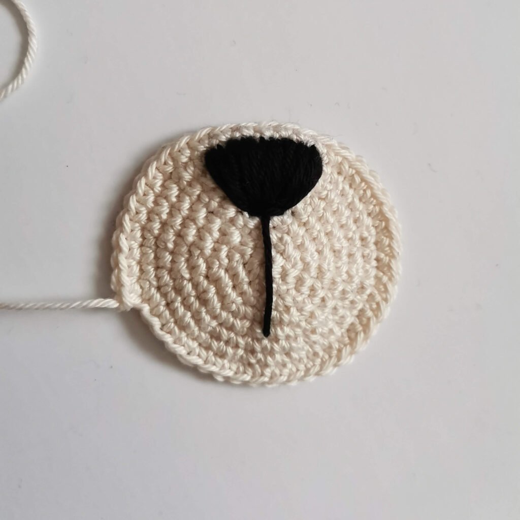 Embroidery nose on a muzzle for a classic amigurumi teddy bear free pattern by EmmaS Dolls.