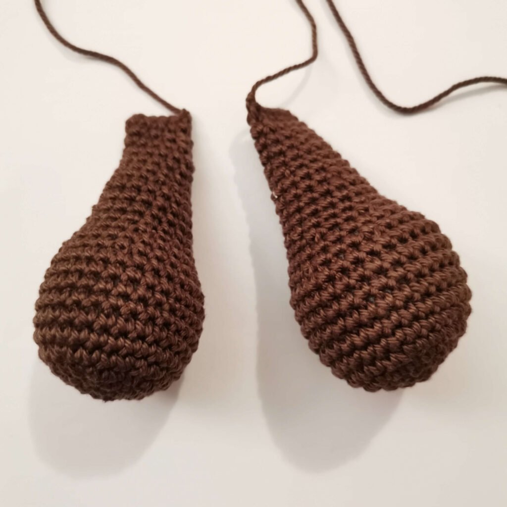 Two finished crochet arms for a classic amigurumi teddy bear free pattern by EmmaS Dolls.