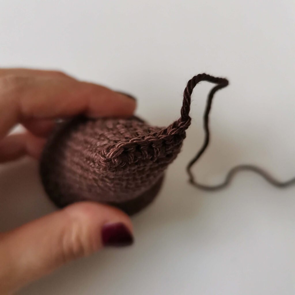 Closing the top of an amigurumi bear leg using clean stitches