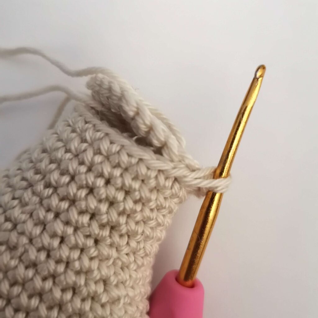 Crocheted circular flat base piece for the bottom of the severed amigurumi hand and connecting to the bottom of the hand.